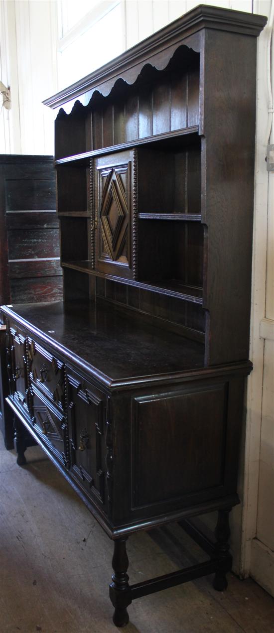 Panelled oak standing corner cupboard